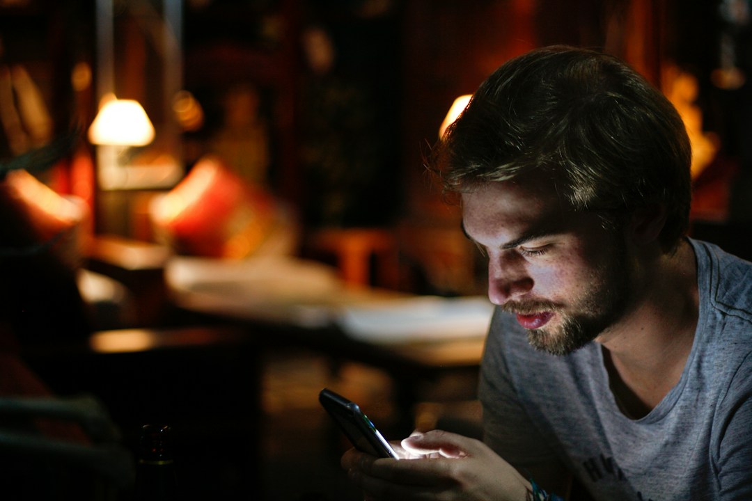 A person checking a suspicious message on a phone
