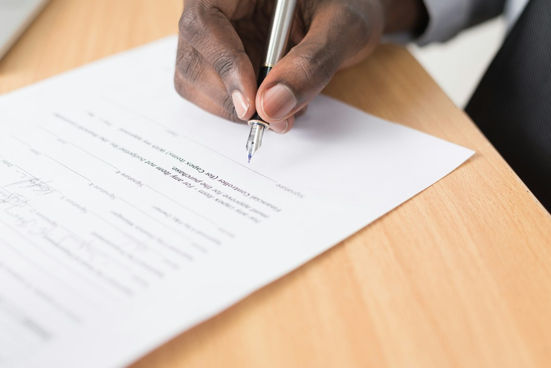 Person signing a document before another person