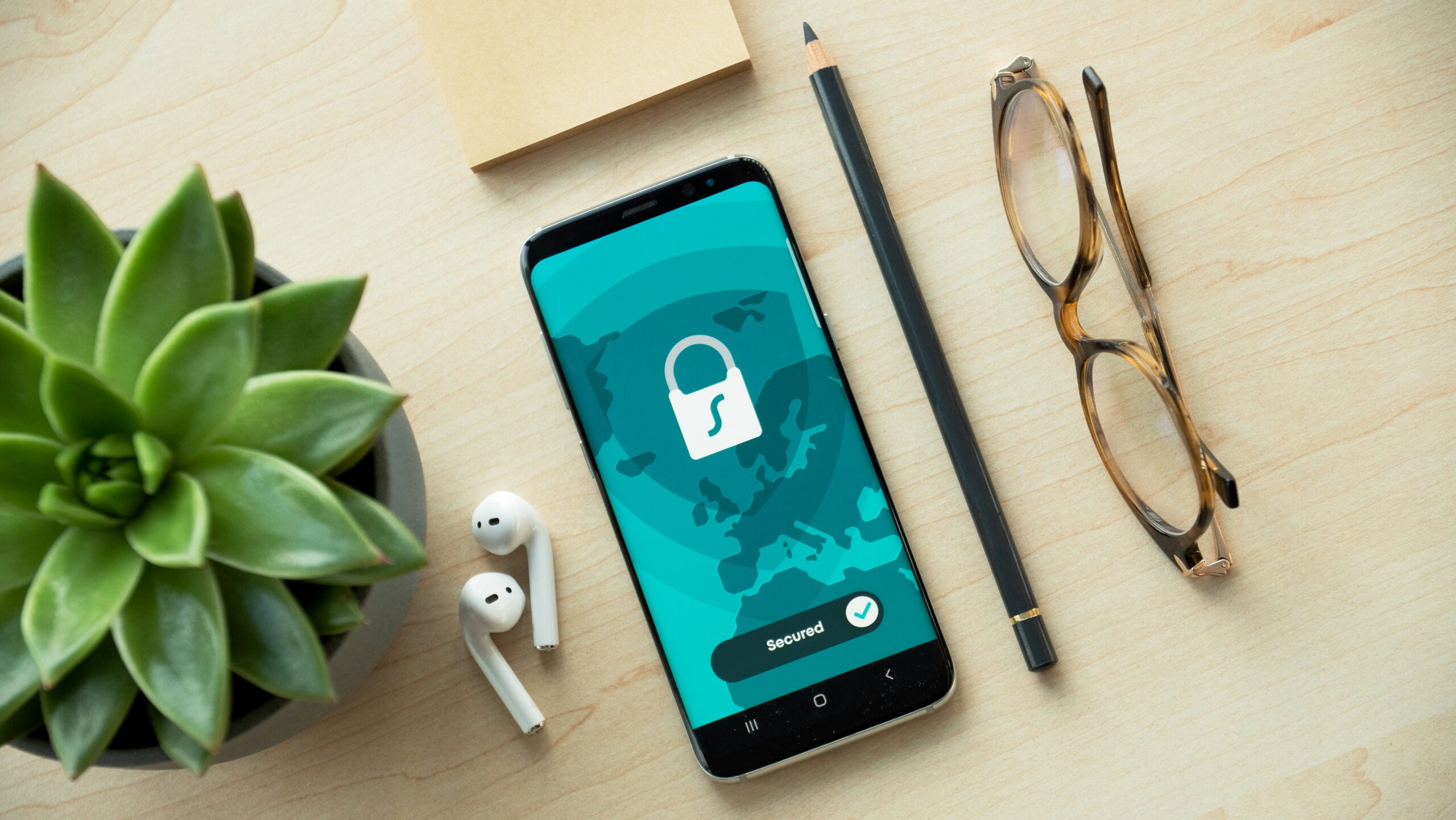 A smartphone beside an identity document, representing personal data privacy