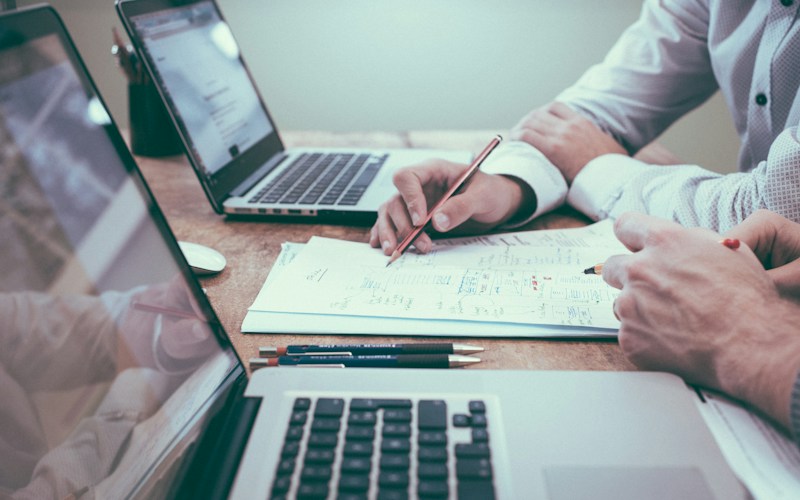 Person reviewing family and financial documents related to custody and alimony in divorce